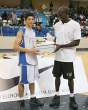 Bo Outlaw of the Orlando Magic gives the trophy to Elio Sadiku from France the MVP of the All-Star Game during Basketball Without Borders on August 10, 2007 in Paris, France..jpg
