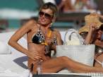 rita-rusic-black-bikini-tanning-miami-09-580x435.jpg