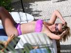 Reese-Witherspoon-Relaxes-Poolside-In-A-Purple-Bikini-In-Honolulu-03-580x435.jpg